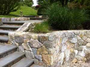 Stone and slate retaining wall and step stairs designed and installed by Gossett Brothers Nursery, South Salem, NY